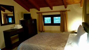 
Ένα ή περισσότερα κρεβάτια σε δωμάτιο στο Ξενώνας Οδυσσέας
