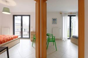a bedroom with a bed and a table and a chair at Rooftop Luxembourg Ville in Luxembourg