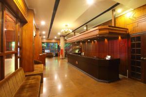 a lobby with a bar in a building at Trichur Towers in Trichūr
