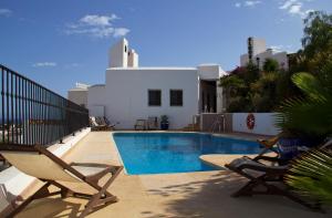 Bazén v ubytovaní Hostal El Dorado alebo v jeho blízkosti