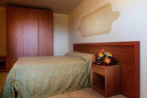 Łóżko lub łóżka w pokoju w obiekcie Hotel Salento