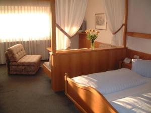 Postel nebo postele na pokoji v ubytování Hotel Ritter