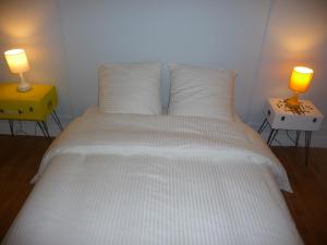 Ein Bett oder Betten in einem Zimmer der Unterkunft ZenAttitude entre Paris et Versailles La Defense Velizy