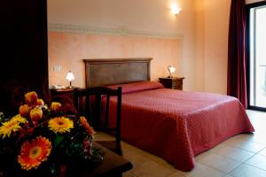 Łóżko lub łóżka w pokoju w obiekcie Hotel Salento