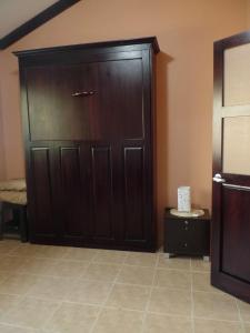 a large wooden door in the corner of a room at Sweet Dreams in Coco +10 photos