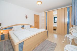 Ένα ή περισσότερα κρεβάτια σε δωμάτιο στο Appartement Monika Schwaiger