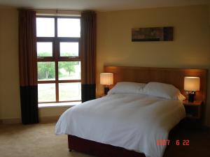 Voodi või voodid majutusasutuse Upton Court Hotel toas