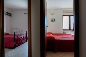 Łóżko lub łóżka w pokoju w obiekcie Hotel Salento