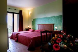 Łóżko lub łóżka w pokoju w obiekcie Hotel Salento