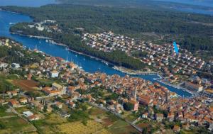 an aerial view of a town next to a river at Room Rade in Stari Grad