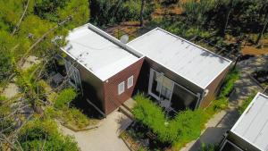 an overhead view of a small house in a forest at Quinta Dos Amarelos no Meco in Aldeia do Meco
