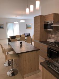Kjøkken eller kjøkkenkrok på Azure Cottage