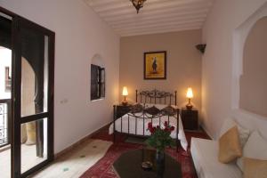 Katil atau katil-katil dalam bilik di Riad Palmier