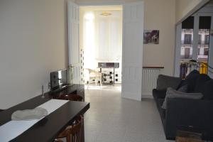 a living room with a couch and a table at Placido Apartment in Manresa