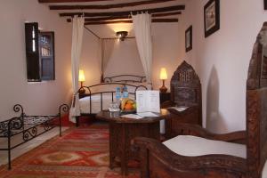 Katil atau katil-katil dalam bilik di Riad Palmier