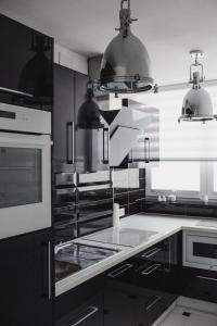 Kuchyňa alebo kuchynka v ubytovaní Grodzka Apartament Centrum + 3 fotografie