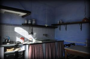 a kitchen with a sink and a counter top at Podere di Maggio - Casa della Nonna in Santa Fiora +17 photos