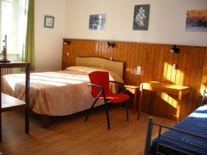 Postel nebo postele na pokoji v ubytování Hôtel Modern