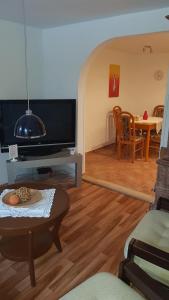 A television and/or entertainment centre at APARTMAN Marcela