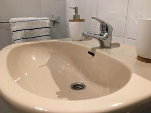 a white sink with a faucet on a counter at La Puntica Carboplaya in Carboneras