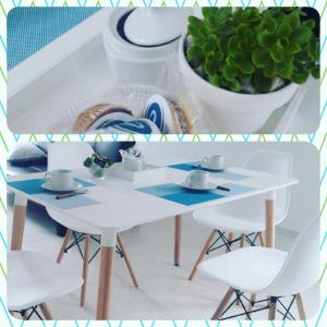 a white table and chairs and a plant at Complejo Pirovano in Lincoln +28 photos