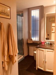 a bathroom with a sink and a shower at Bed&Breakfast Edel in Genova +23 photos