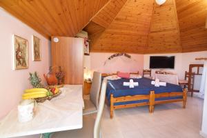 a bedroom with a bed in a room with wooden ceilings at Lydia studio in Minia