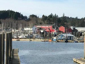 a marina with a bunch of boats in the water at Inn at Harbour Village in Ilwaco