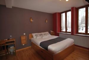 Postel nebo postele na pokoji v ubytování Auberge du Hérisson