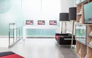 a living room with a couch and a chair at Red Planet Manila Bay in Manila