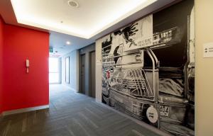 a hallway with a large mural on the wall at Red Planet Manila Bay in Manila
