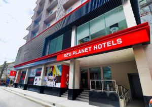 a red har target hotel on a city street at Red Planet Manila Bay in Manila