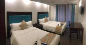 Postel nebo postele na pokoji v ubytování El Puerto Boracay + 2 fotografie