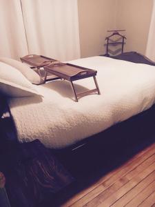En eller flere senge i et værelse på Suites North Hatley