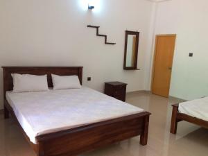 A bed or beds in a room at Punkalasa tourist lodge