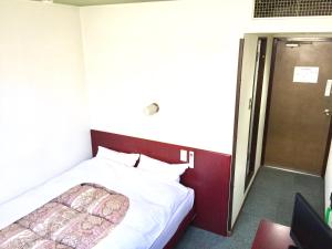 Una cama o camas en una habitación de Green Hill Hotel Tennoji Ekimae