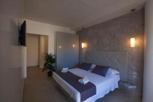 Postel nebo postele na pokoji v ubytování Avantgarde Hotel