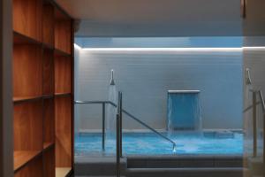 a bathroom with a pool of water in a room at Es Princep - The Leading Hotels of the World in Palma de Mallorca