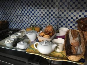 a kitchen counter with a tea pot and other foods at Duplex Little Cottage in Abbeville