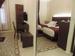 Postel nebo postele na pokoji v ubytování La Place Hotel