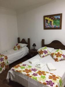 En eller flere senge i et værelse på Pousada Sinhá Moça