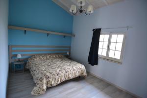 Un pat sau paturi într-o cameră la Oasi di Francesca B&B