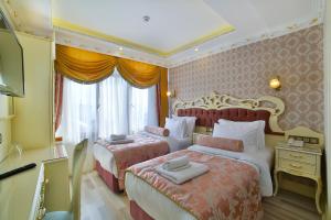 Postel nebo postele na pokoji v ubytování Nayla Palace Hotel-Special Category