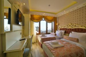 Postel nebo postele na pokoji v ubytování Nayla Palace Hotel-Special Category