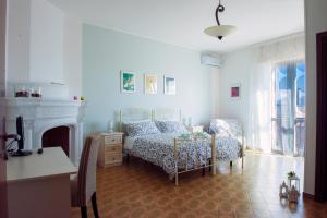 Ένα ή περισσότερα κρεβάτια σε δωμάτιο στο B&B da LEO +18 φωτογραφίες