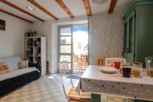 a living room with a table and a couch at Bargujac Summer House in Vis