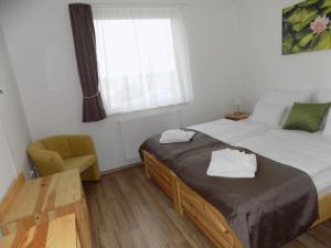 Posteľ alebo postele v izbe v ubytovaní Land-Plan Hotel
