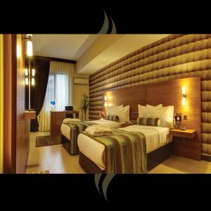 Postel nebo postele na pokoji v ubytování Susuzlu Atlantis Hotel + 25 fotografií