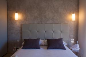 Postel nebo postele na pokoji v ubytování Avantgarde Hotel