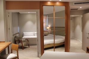 Postel nebo postele na pokoji v ubytování Hotel Carreño + 32 fotografií